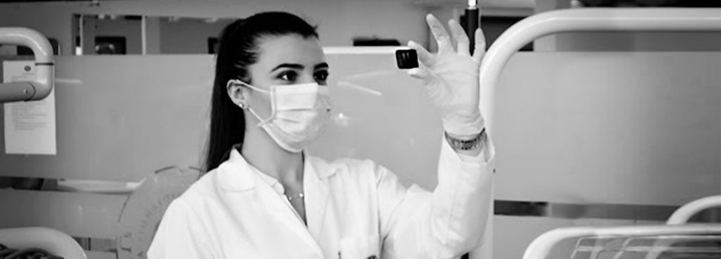 Young dental student working in clinical practice